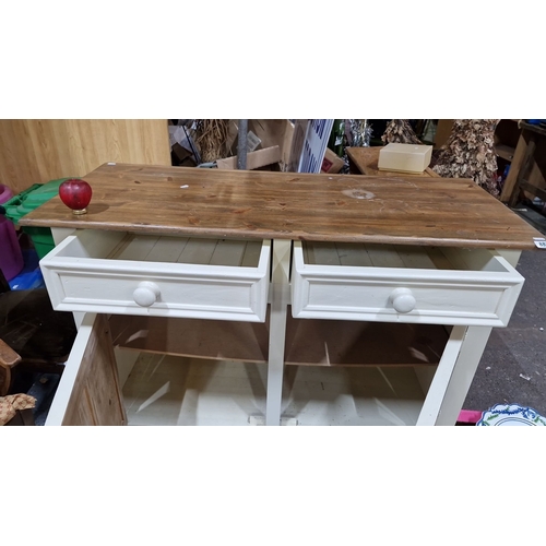 882 - Star lot :Wooden sideboard with natural top and painted cream base, featuring two drawers and two ca... 