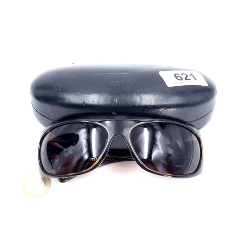 621 - A pair of Prada wrap round sunglasses with faux tortoise shell frames marked 'Made in Italy'. Comes ... 