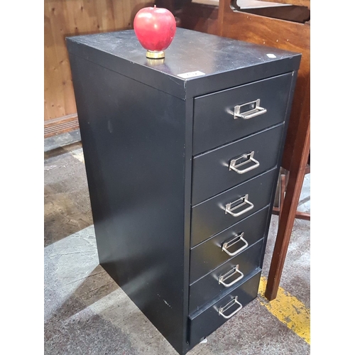 702 - Black metal filing cabinet with five drawers, featuring chrome handles.