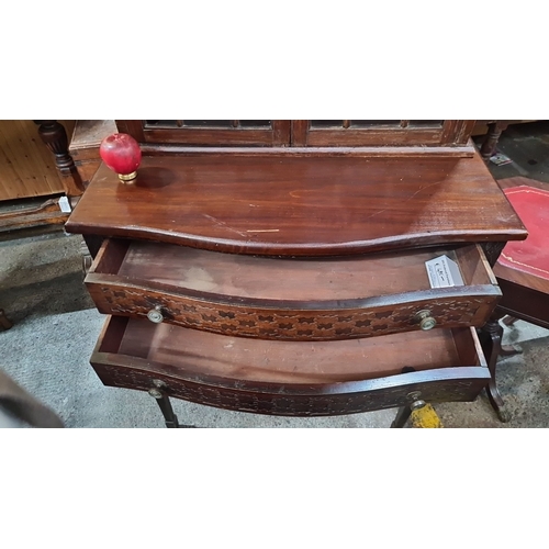 705 - Star Lot : Edwardian mahogany display cabinet with glazed doors and two intricately carved drawers.