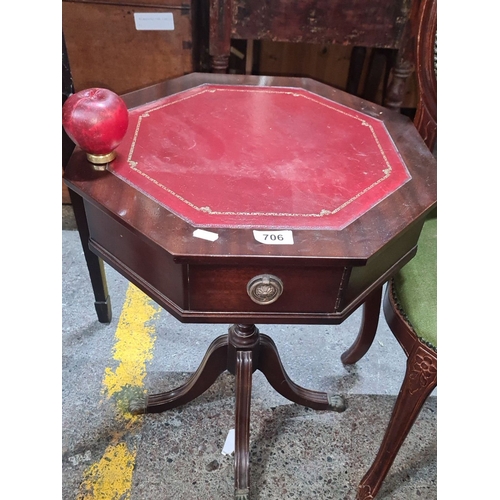 706 - Antique mahogany side table with octagonal top, red leather insert, and single drawer. It has claw f... 