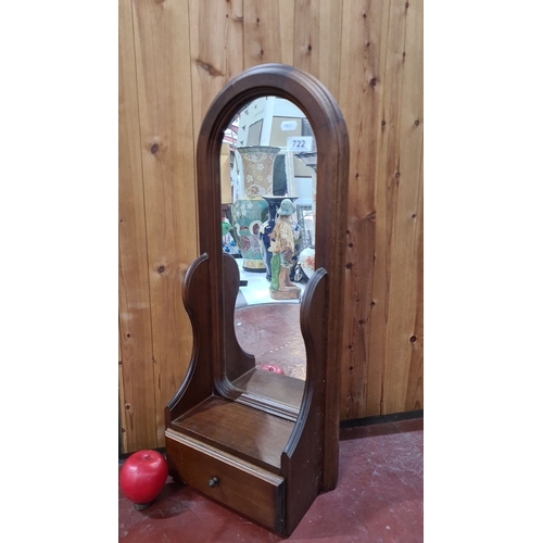 722 - Walnut tabletop mirror with arched design and single drawer.