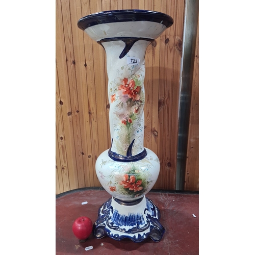 723 - Bone pedestal vase with floral design, featuring blue accents and intricate detailing, from the mid-... 