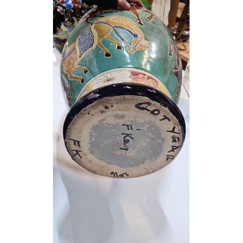 727 - Star Lot : A very Colorful large ceramic vase featuring floral patterns and horses, with intricate d... 