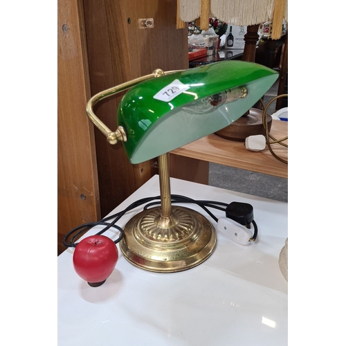 729 - Brass banker's lamp with green glass shade, Mid-Century Modern design, features adjustable brass arm... 