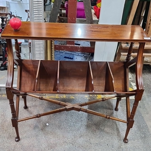 739 - Edwardian mahogany Canterbury with turned supports and dividers, supported on a delicate stretcher f... 