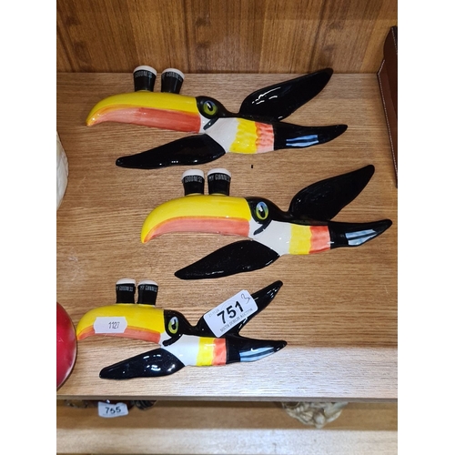 751 - Three Ceramic toucan wall plaques, featuring a Guinness motif.