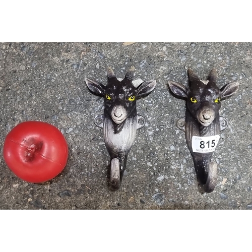 815 - Pair of whimsical goat head  heavy cast iron hooks with hand-painted details. Accompanied by a red r... 