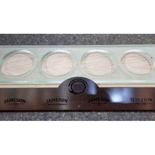 821 - Set of two whiskey tasting trays: one metal with Jameson branding and one wooden for Classic Malts, ... 