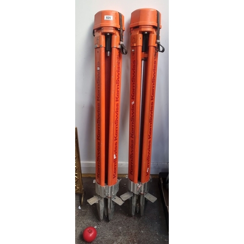 825 - Pair of orange Kern Swiss surveyor tripods, featuring robust design and adjustable legs.