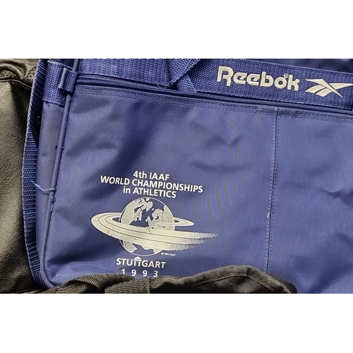 832 - Collection of eight vintage sports and travel bags, featuring Reebok and Marlboro branding, includin... 