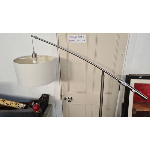 1090 - Star lot : An Adjustable designer floor lamp features a sleek chrome finish and a white drum shade w... 