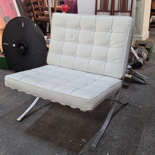 1101 - Star lot :White leather Barcelona chair with a stainless steel frame and tufted cushioning. Inspired... 