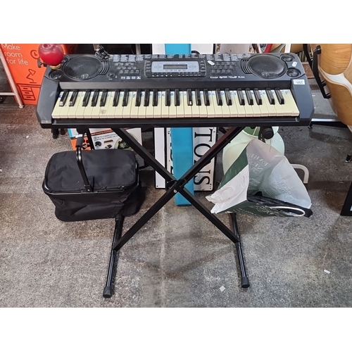 1125 - Yamaha PortaSound PSS-260 electronic keyboard has 54 keys and integrated speakers. Includes stand an... 