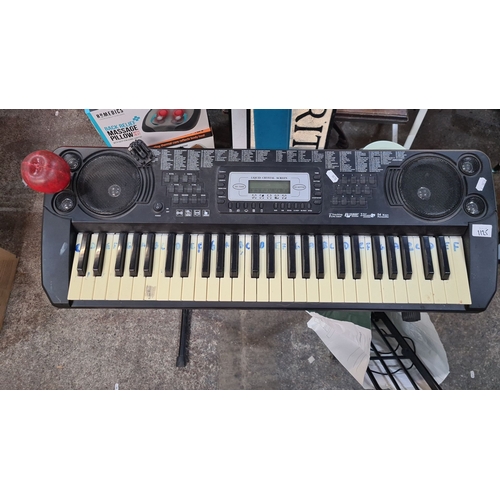 1125 - Yamaha PortaSound PSS-260 electronic keyboard has 54 keys and integrated speakers. Includes stand an... 