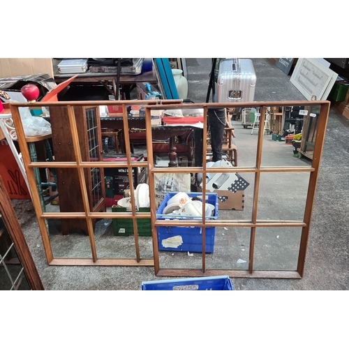 1128 - Star lot : A Pair of wooden mid century grid design mirrors with multiple panes, featuring rustic ch... 