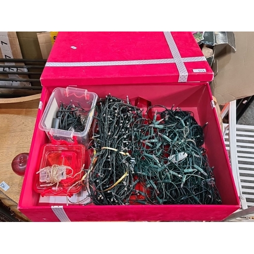 1129 - Box of assorted Christmas string lights, various lengths and styles, neatly organized in a red stora... 