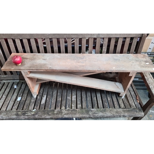 1132 - Rustic wooden bench crafted from solid wood, featuring a minimalist design with simple joinery. Meas... 