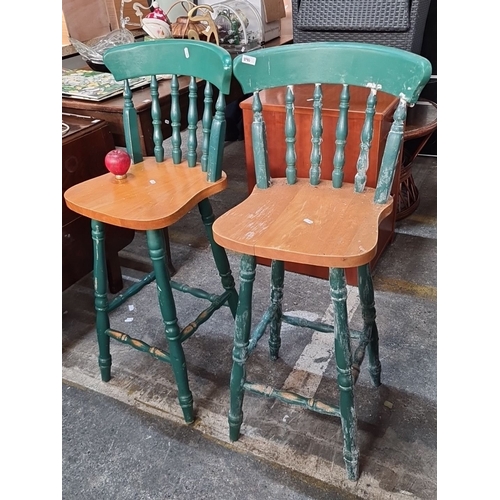 1140 - Pair of rustic green wooden bar stools with curved backrests and spindle details.