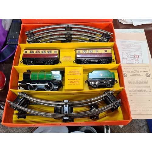 1144 - Vintage Hornby train set, featuring locomotive, two carriages, and track. Made in England by Meccano... 