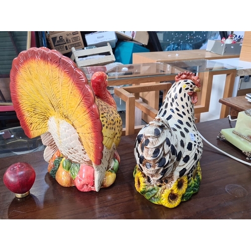 1147 - Two Colorful ceramic turkey and hen figurines, hand-painted with vibrant detailing. Ornamental piece... 