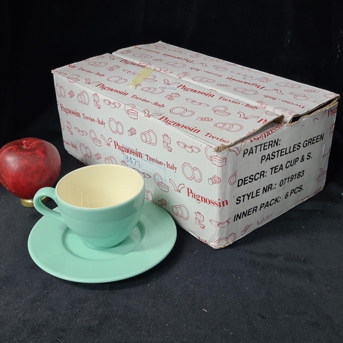 1020 - A box of new old stock containing ceramic cups and saucers. Includes six cups and seven saucers. Wit... 