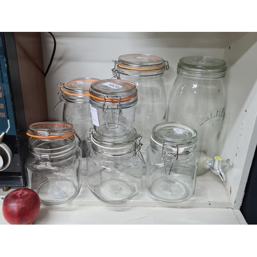 1029 - A collection of glass Kitchenware items. Includes four 'Kilner' and two 'Ravenhead' airtight mason j... 