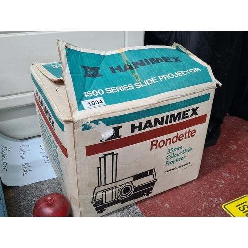 1034 - A 35 mm 'Hanimex Rondette' 1500 series colour slide projector. In original box.