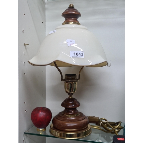 1043 - A vintage brass and worked wood table lamp with hand blown cream shade.