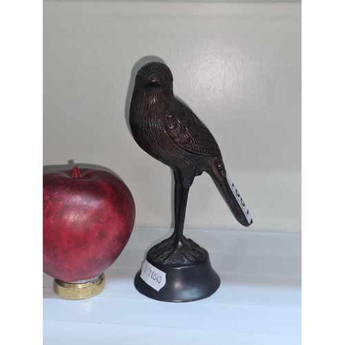 1061 - A heavy vintage cast bronze figure of poised bird. Unmarked.