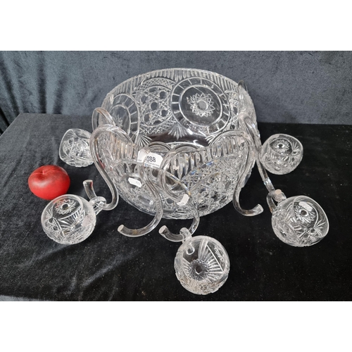 1088 - A super Cavan Crystal punch set including a very large punch bowl, five cups, and seven hooks. All i... 