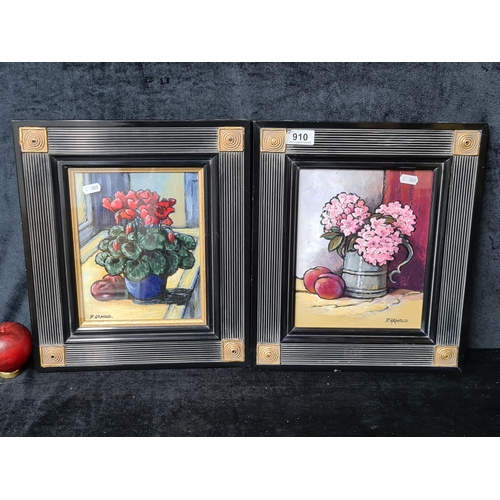 910 - A pair of 'P. Arnold' original oil on board paintings. Features still life botanical studies of flow... 