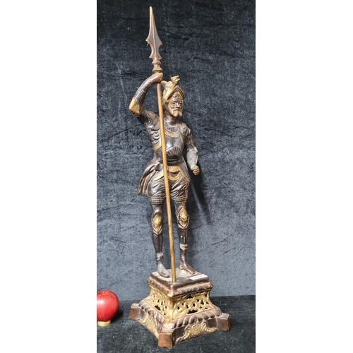 943 - Star lot :A large antique brass sculpture in the form of a Roman solider. Great weight to this piece... 