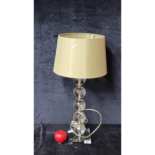 961 - A heavy and stylish bulbous table lamp. Fabricated from crystal and chrome with an olive green cylin... 