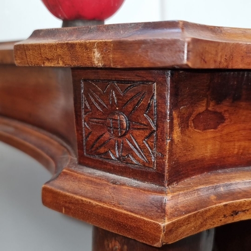 1243 - A very handsome Victorian mahogany console table with intricately carved scroll legs and a shaped to... 