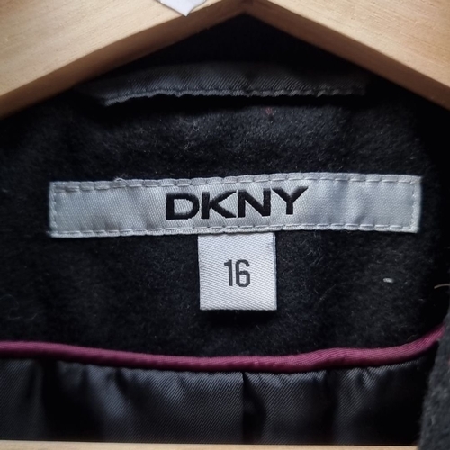 1305 - DKNY black wool coat, size 16, featuring asymmetrical zipper and shawl collar.
Previous in auction o... 