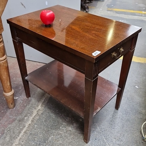 1359 - Wooden side table with brass handles, featuring a single drawer and lower shelf. Emphasizes practica... 