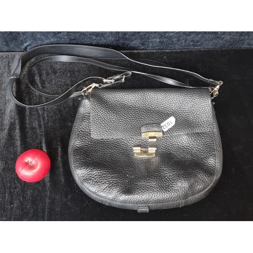 1372 - An original designer Furla grained leather shoulder bag complete with brass hardware and dust bag. R... 