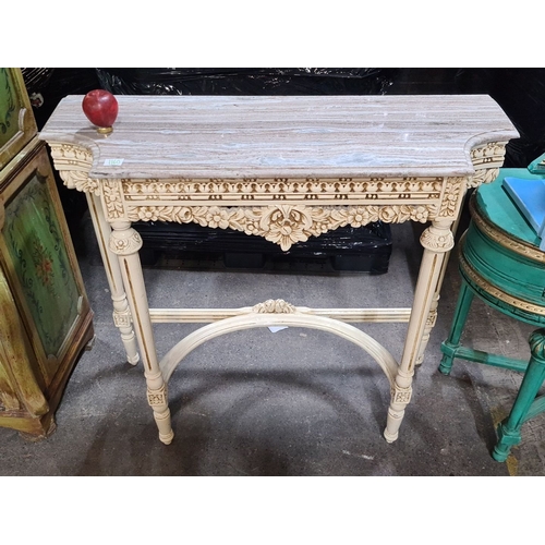 1380 - Star Lot : Console table with a marble top, ornately carved with intricate floral motifs, from the V... 