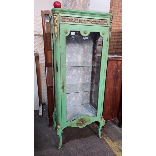 1384 - Star Lot : Ornate Art Nouveau display cabinet with gold detailing, glass panels, and tropical interi... 