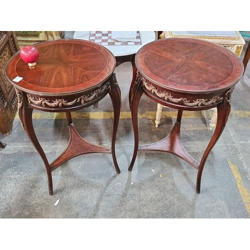 1386 - Pair of Art Nouveau mahogany side tables with intricate floral ormolu details, with a circular top a... 