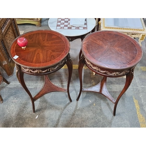 1386 - Pair of Art Nouveau mahogany side tables with intricate floral ormolu details, with a circular top a... 