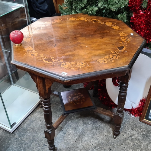 1172 - Star lot : A beautiful antique octagonal mahogany occasional table featuring turned legs marquetry p... 