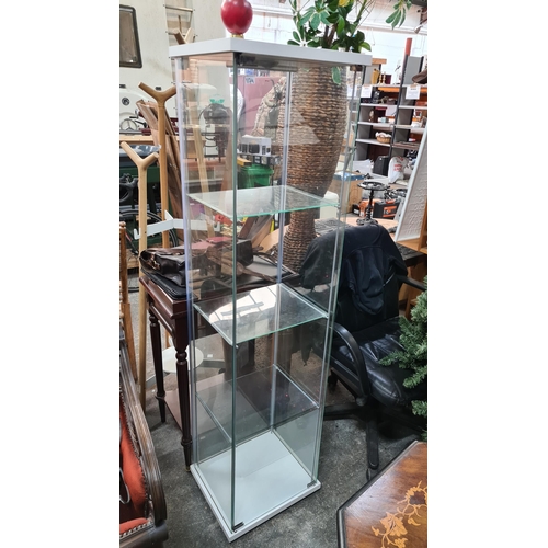 1174 - A four tiered glass display shelving unit. Ideal for a shop display.