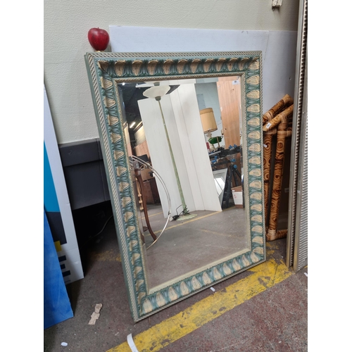 1183 - A lovely large beveled wall mirror in toned of blue and yellow with floral detailing to frame. Match... 