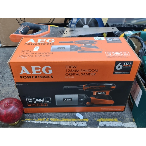 1201 - A brand new  AEG 300Watt 125 mm Random Orbit Sander Powertool. Model no. EX125EX
In original box. 
S... 