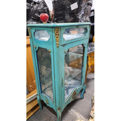 1216 - Star Lot : An elegant French Chateau style duck egg blue glass display cabinet. With two interior gl... 