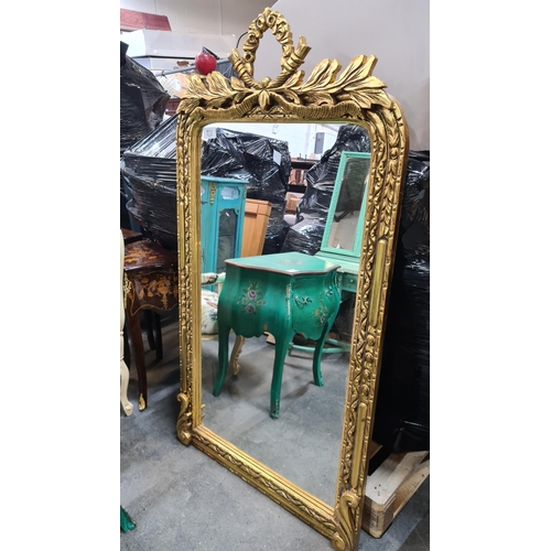 1231 - Star Lot : A wonderful large French style mirror. Housed in an elaborate gilded and carved frame. Fe... 