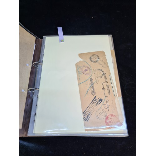 337 - A folder containing Irish postal memorabilia, album of all sorts, Saorastat Eireann envelopes, antiv... 