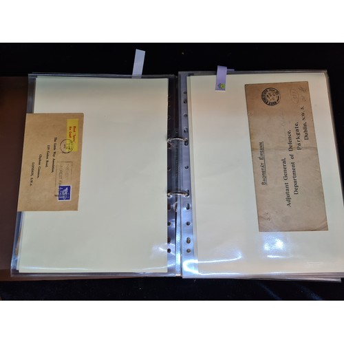 337 - A folder containing Irish postal memorabilia, album of all sorts, Saorastat Eireann envelopes, antiv... 